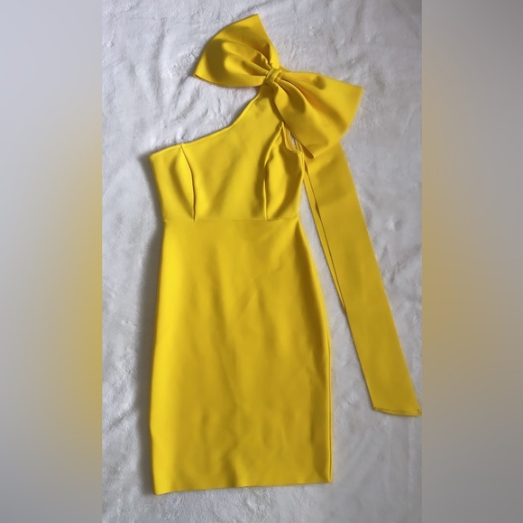 Dresses & Skirts - One shoulder yellow dress with a beautiful bow on the one shoulder